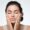 Close-up of girl exfoliating face with natural sugar scrub